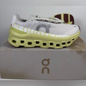 On Running White and Yellow Athletic Shoes